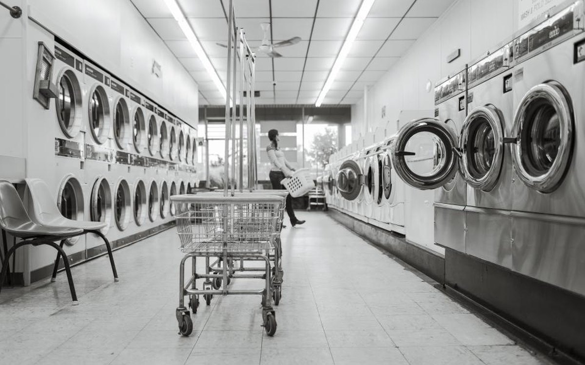 Commercial laundry room with carts staged for sorting and delivery